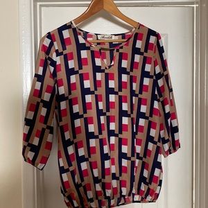 Geometric dressy top